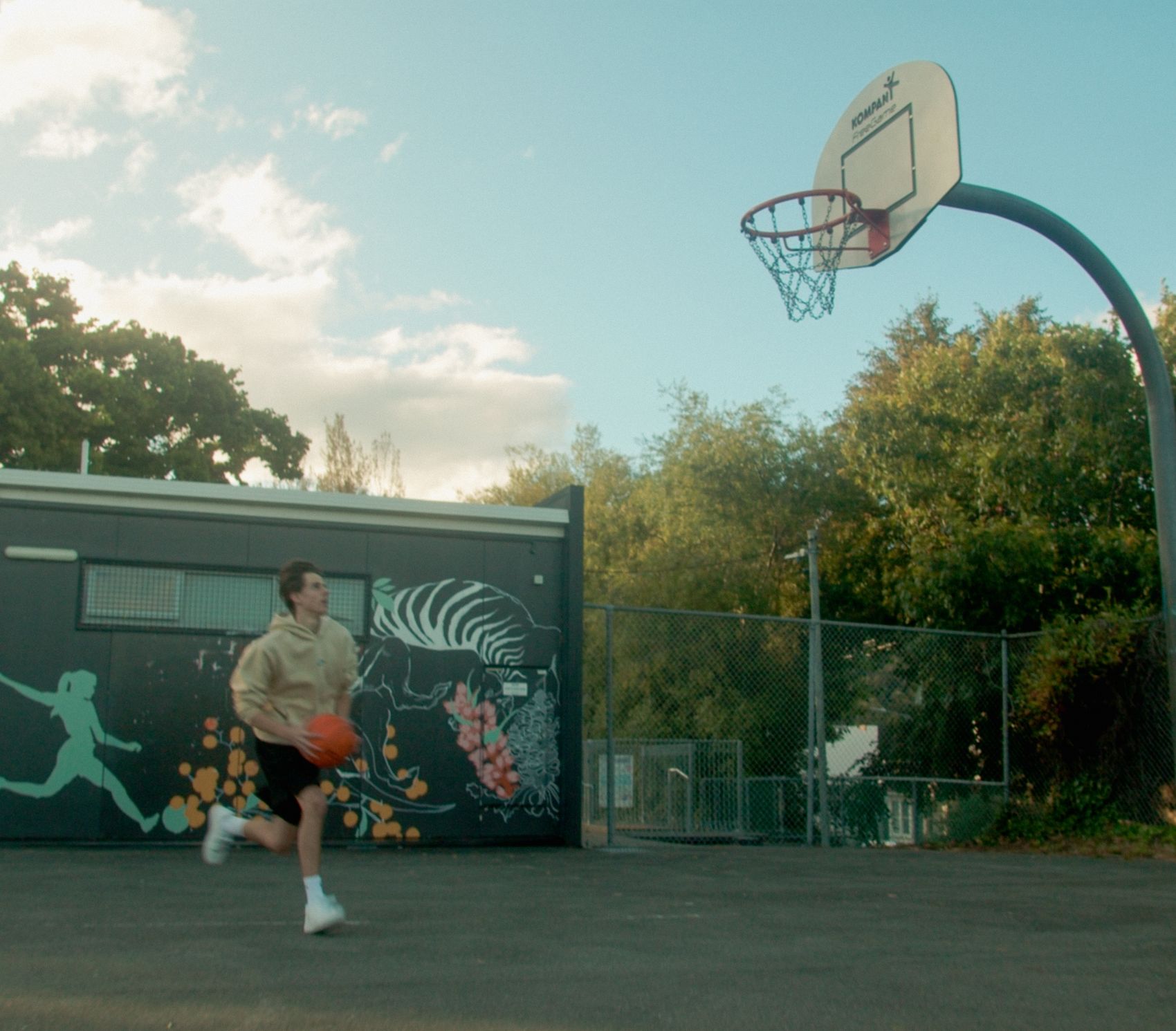Driving to the hoop in the cream Angora hoodie