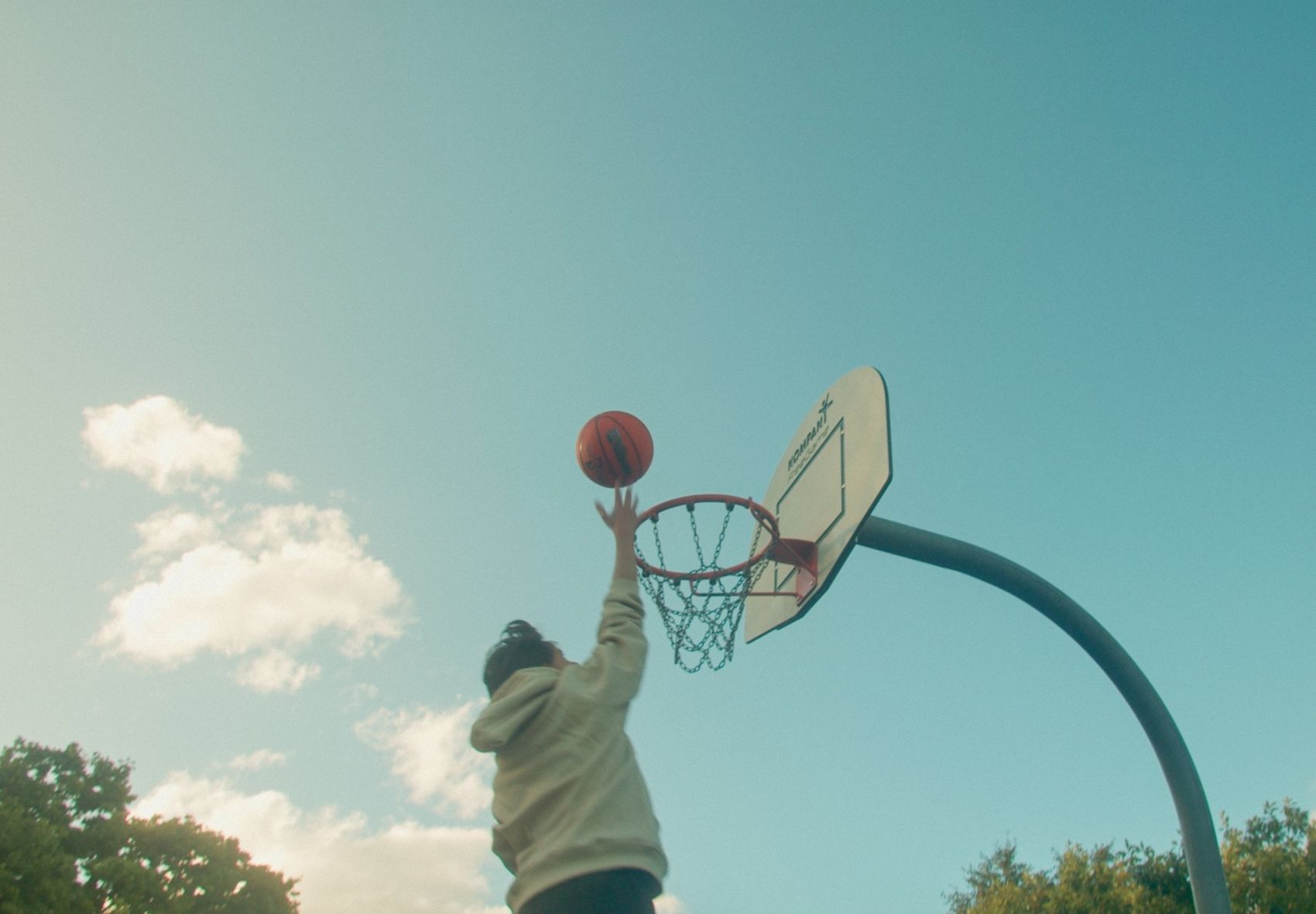 Going up for a layup in the cream Angora hoodie