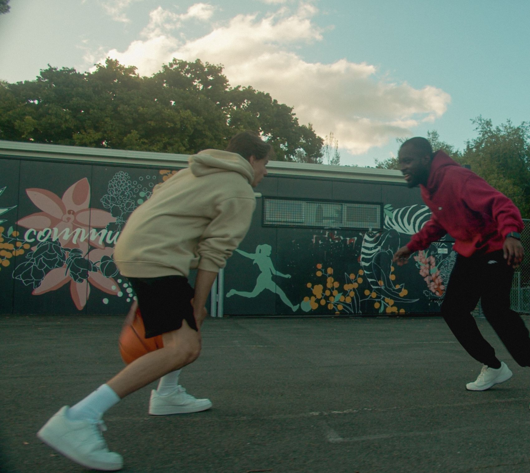 One-on-one on an outdoor court in Angora hoodies